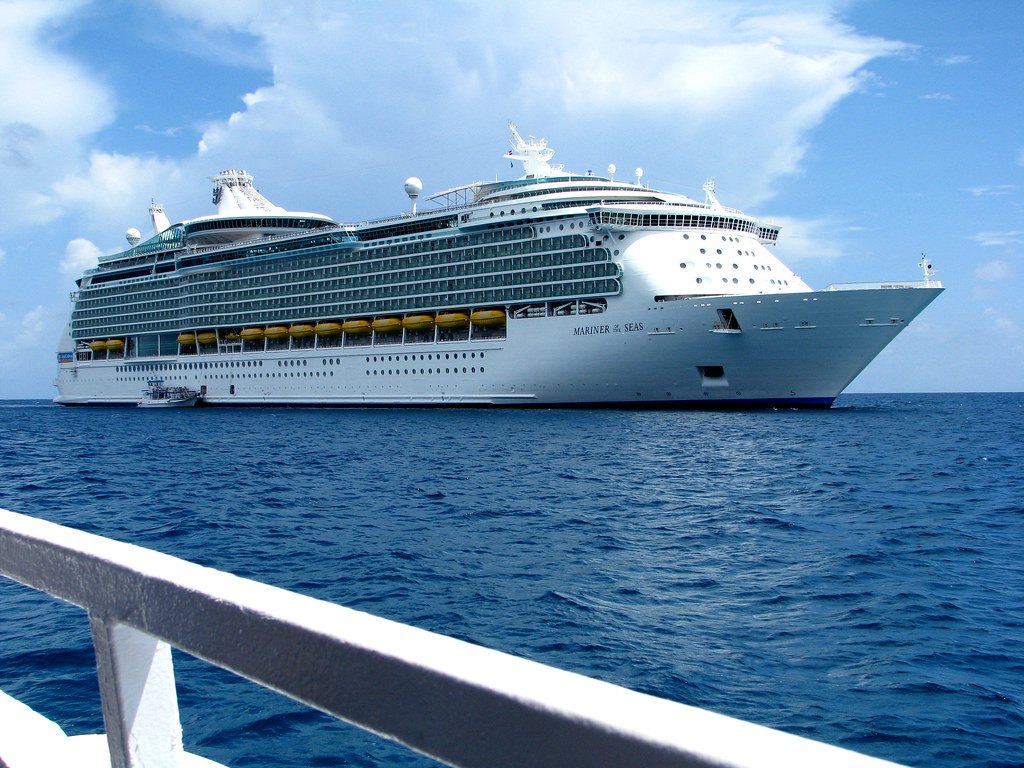 Mariner of the Seas at anchor in clear blue water off Perfect Day at CocoCay in the Bahamas